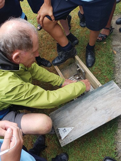 Roel Michels demonstrates how a standard rat trap works.